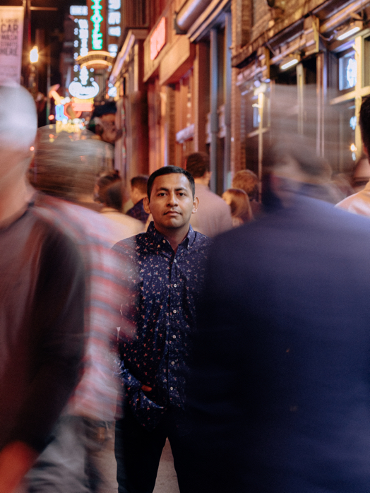 Cesar on a busy sidewalk in downtown Nashville