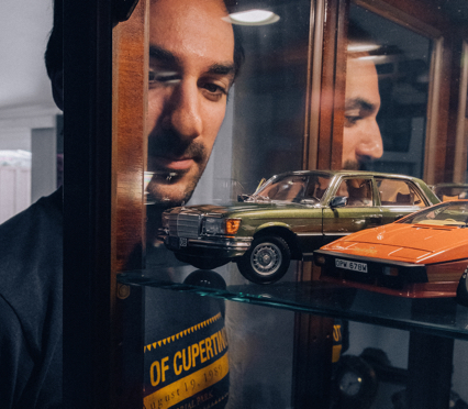 Shervin looking at his model car collection